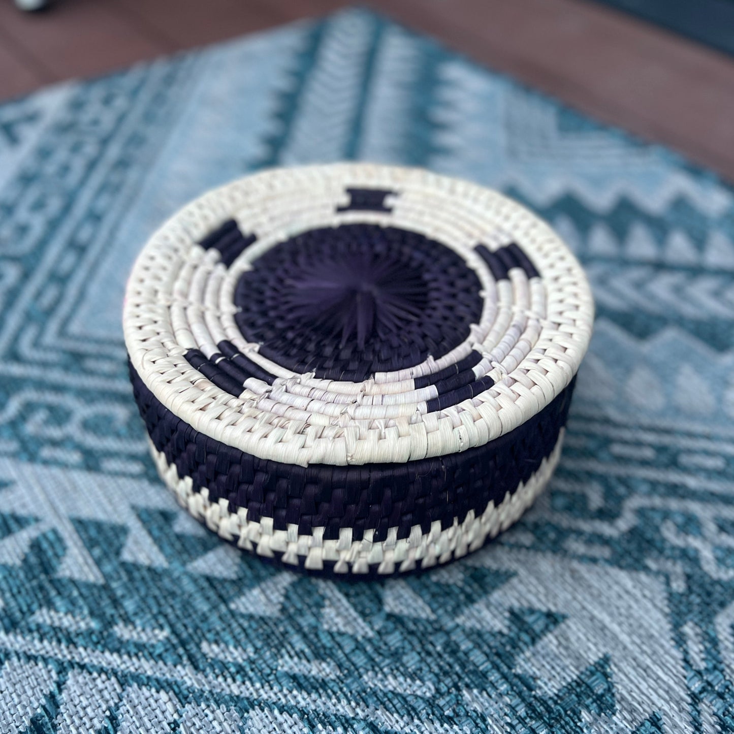 Black & white woven hot pot basket made by artisans with date palm leaves