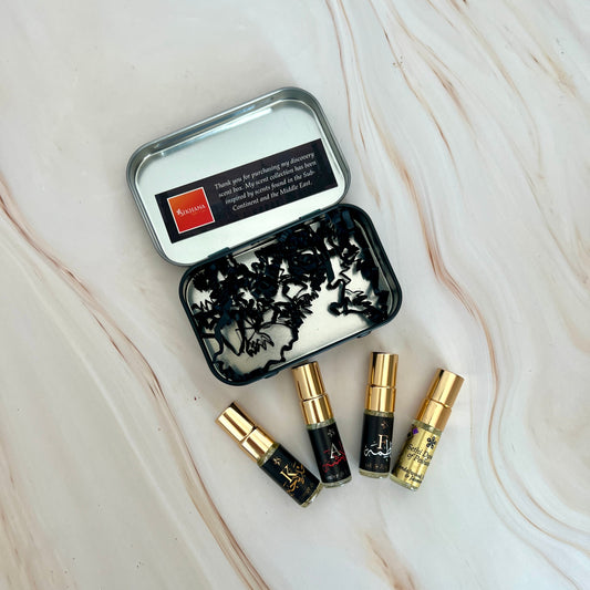 Set of small bottles with gold caps on a marble surface