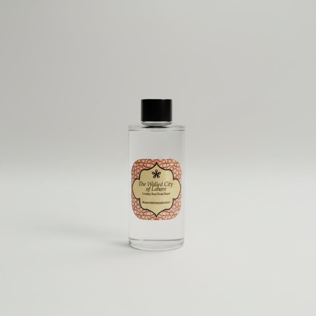 Small bottle with a label on a reflective surface