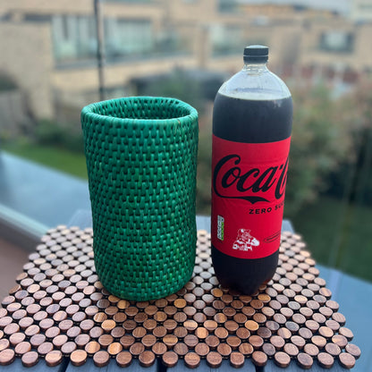 Green Bottle holder using date palm leaves woven by artisans in Sindh Pakistan