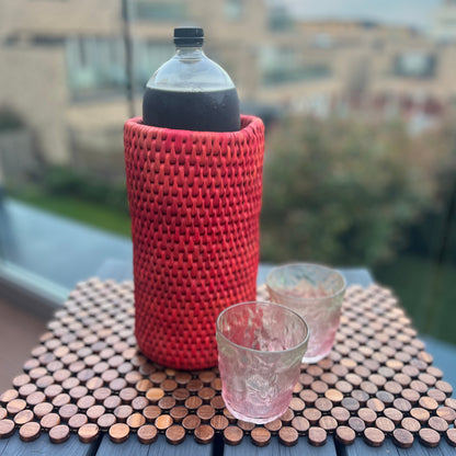 Red Bottle Holder made of date palm leaves by artisans in Sindh Pakistan