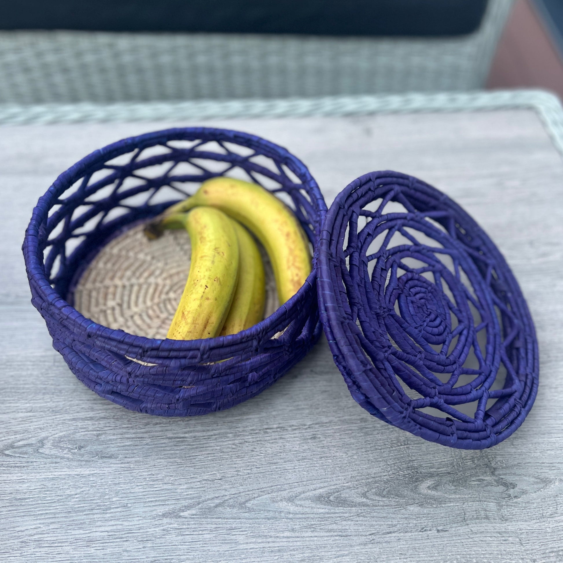 Blue woven fruit basket using date palm leaves