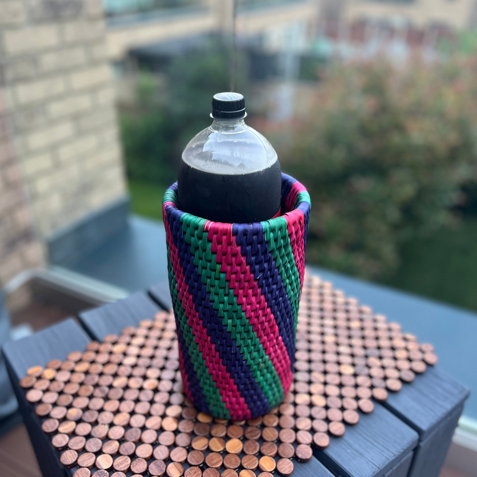 Green, pink and blue striped bottle holder