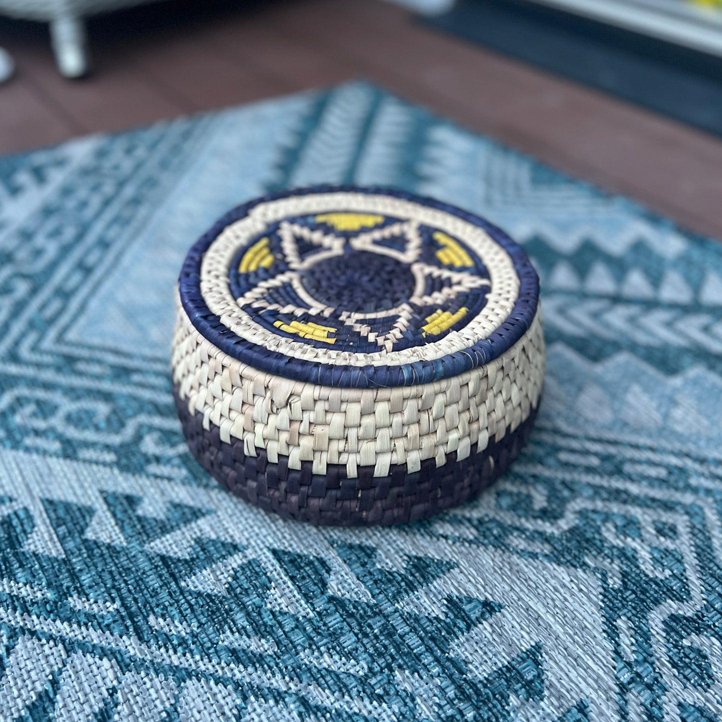 Blue, white and yellow woven hot pot basket made by artisans with date palm leaves